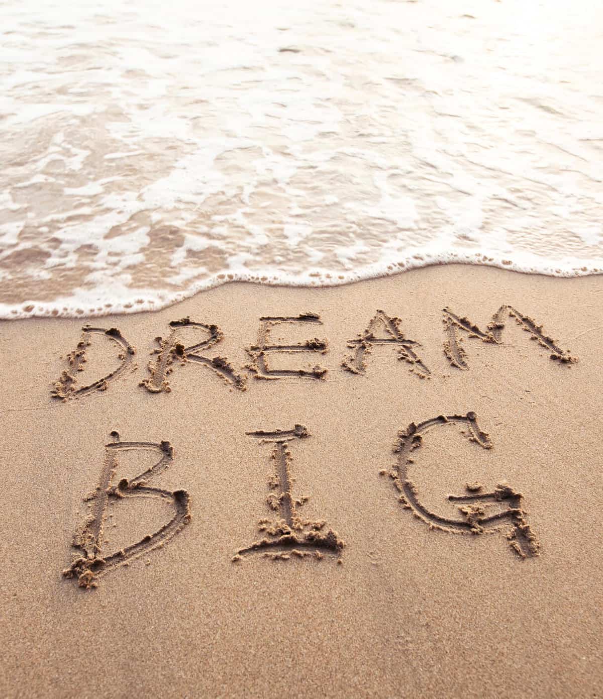 Dream Big written in sandy beach