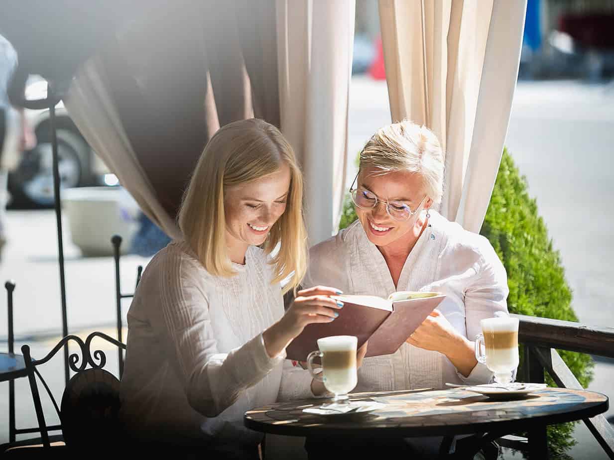 mother and daughter reading her book