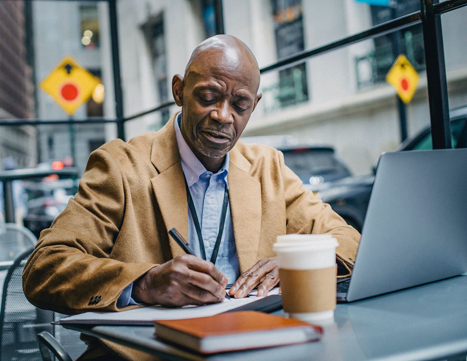 African American man writing book
